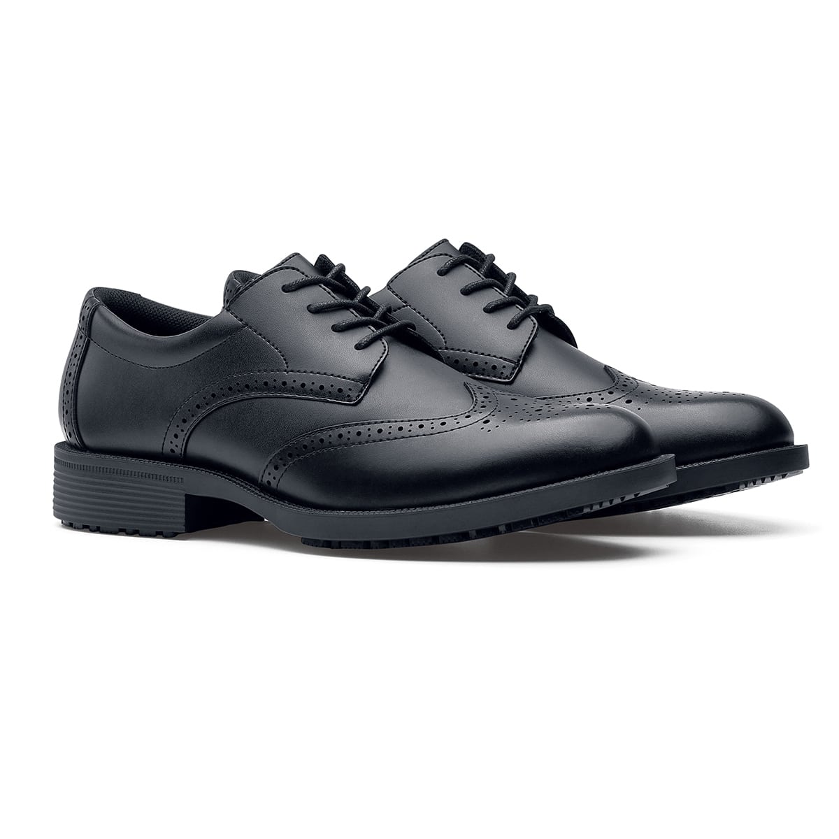 The Executive Wing Tip IV from Shoes For Crews, is an slip resistant dress shoe with a water resistant breathable leather upper to provide industry leading levels of grip and durability, pair seen in profile on the right.