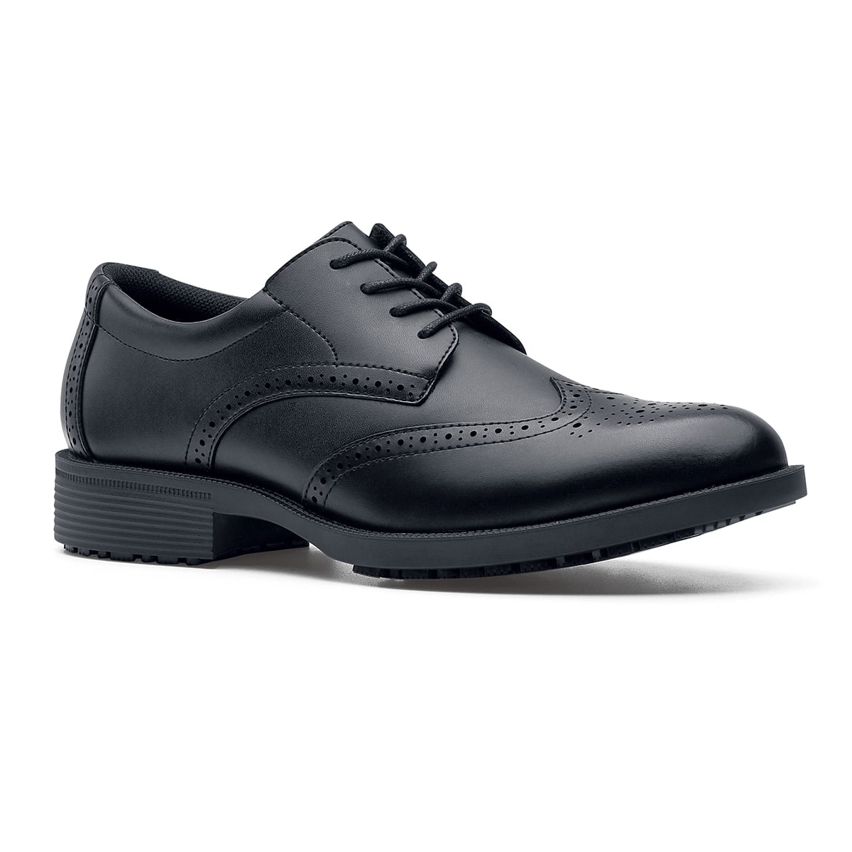 The Executive Wing Tip IV from Shoes For Crews, is an slip resistant dress shoe with a water resistant breathable leather upper to provide industry leading levels of grip and durability, seen from the right profile.