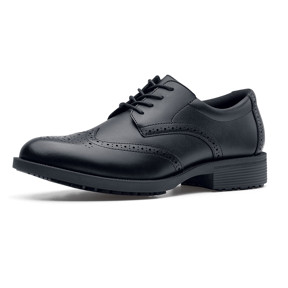 The Executive Wing Tip IV from Shoes For Crews, is an slip resistant dress shoe with a water resistant breathable leather upper to provide industry leading levels of grip and durability, seen from the left profile.
