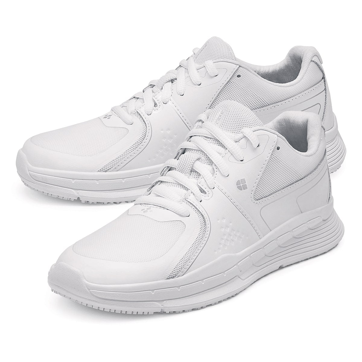 The Condor Women's White from Shoes for Crews is a slip-resistant shoe with laces, with additional padding and a removable cushioned insole ,pair seen from the left side, emphasised on the tip of the left shoe.