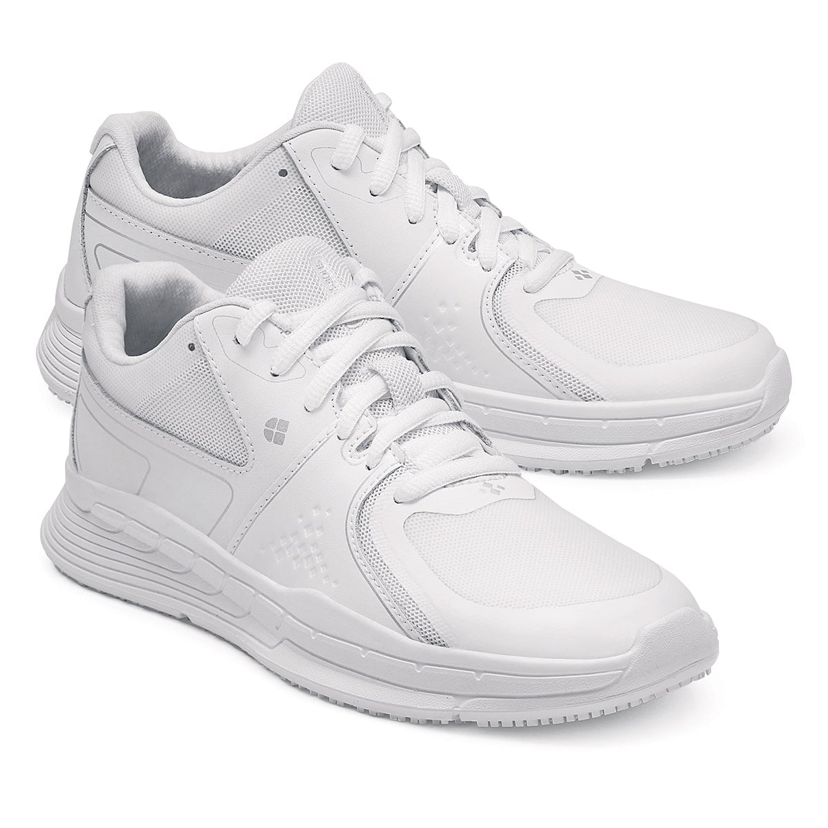 The Condor Women's White from Shoes for Crews is a slip-resistant shoe with laces, with additional padding and a removable cushioned insole ,pair seen from the right side, emphasised on the tip of the right shoe.