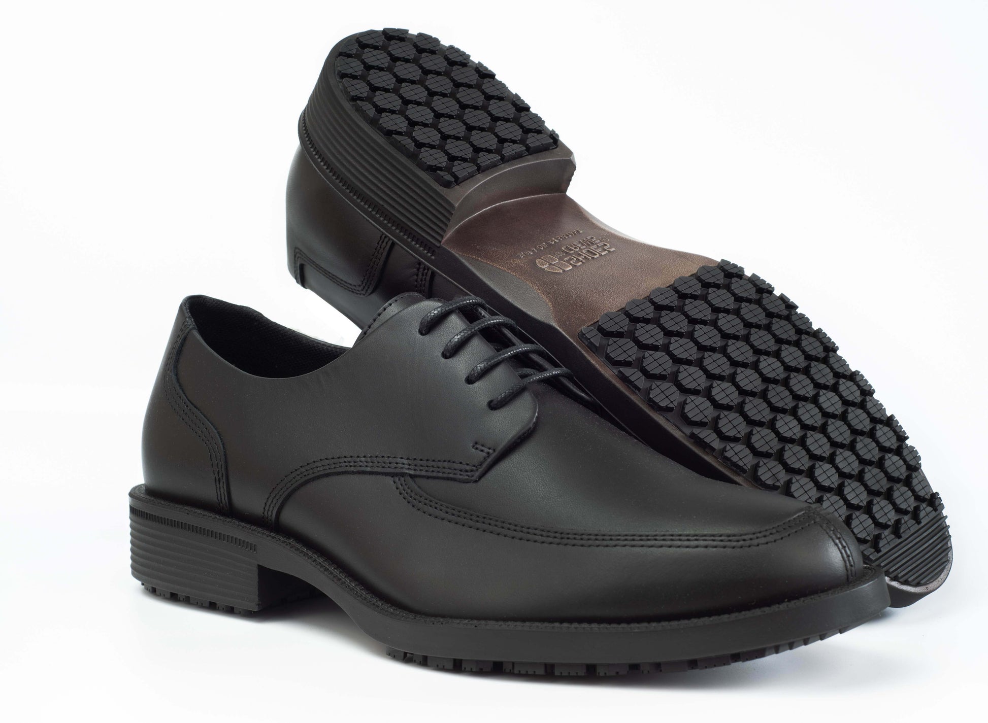 Slip resistant black formal shoe with waterproof leather upper and a removable, cushioned insole, seen from the side and bottom.