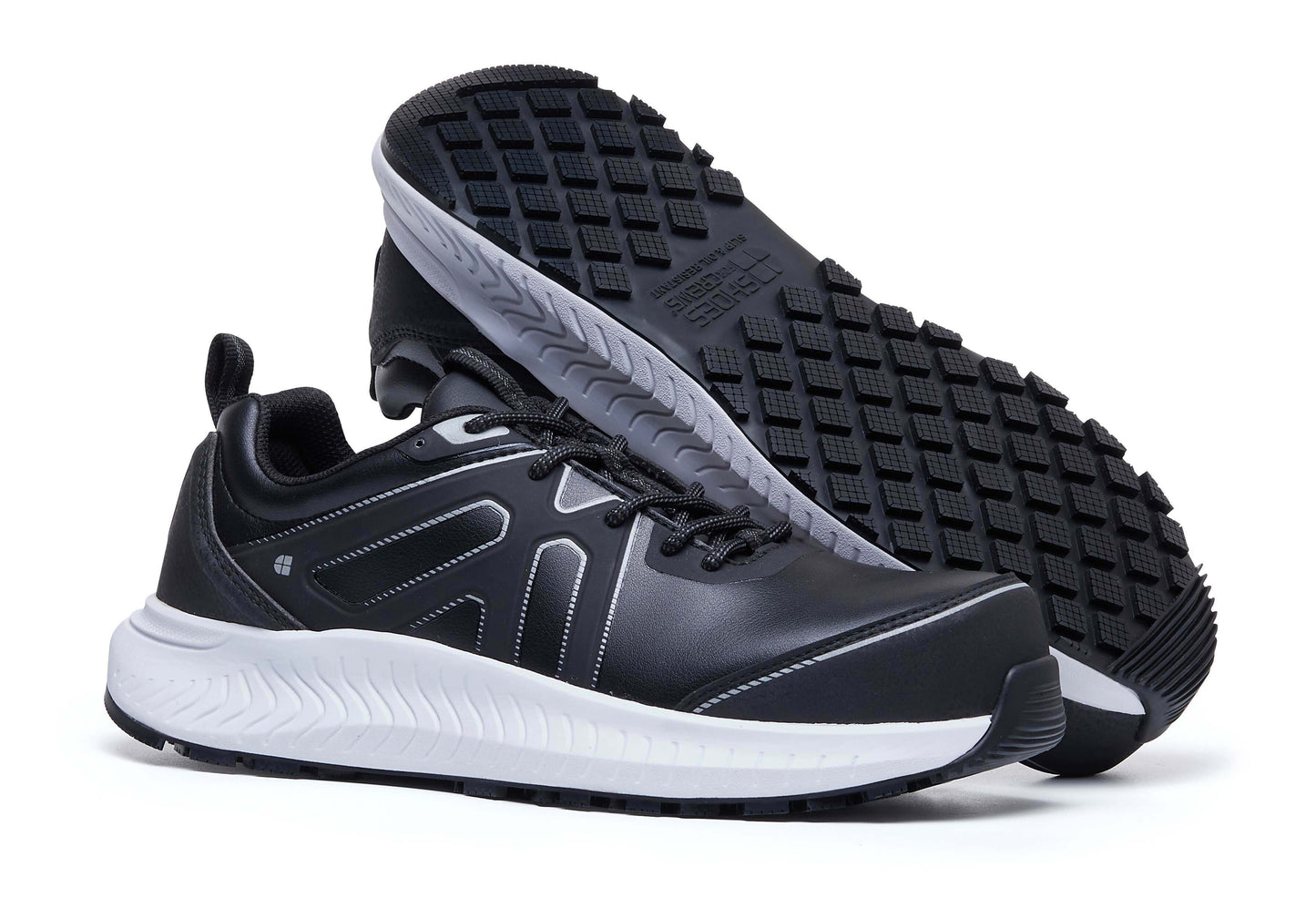 The Colly Black from Shoes For Crews has a slip-resistant, clog-resistant sole with TripGuard technology, a nanocomposite toecap (200 joules) and removable cushioned insoles, pair seen from the right side and sole.