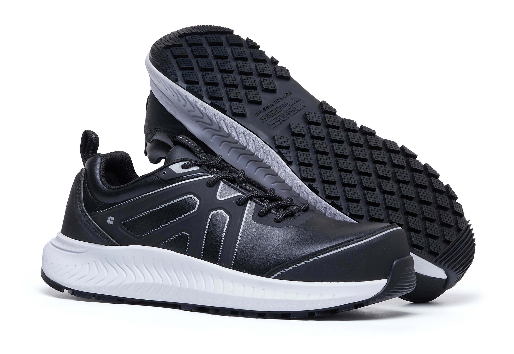 The Colly Black from Shoes For Crews has a slip-resistant, clog-resistant sole with TripGuard technology, a nanocomposite toecap (200 joules) and removable cushioned insoles, pair seen from the right side and sole.