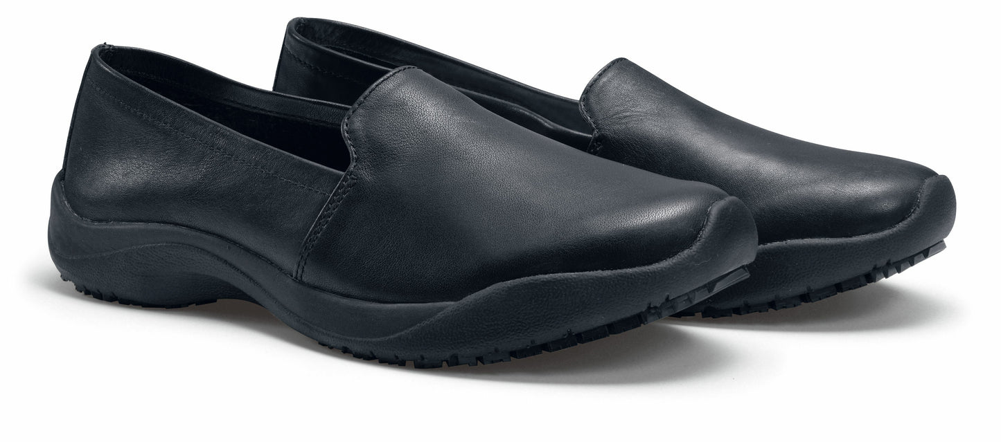The Jasmine Black by Lila from Shoes for Crews are slip-resistant, casual, lightweight and water-resistant shoes, pair seen in profile on the right.