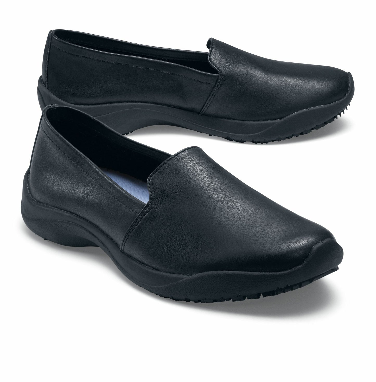 The Jasmine Black by Lila from Shoes for Crews are slip-resistant, casual, lightweight and water-resistant shoes, pair seen from the right side, emphasised on the tip of the right shoe.