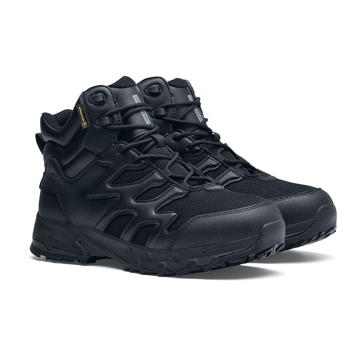 The Shoes for Crews Carrig Mid is a slip-resistant safety boot with a waterproof upper,  pair seen in profile on the right.