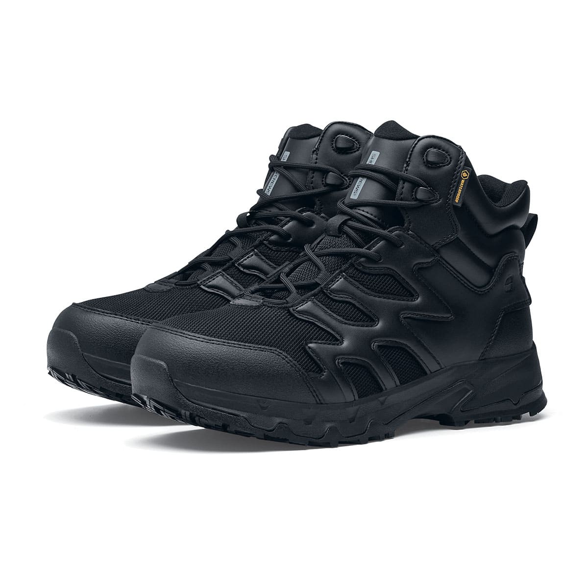 The Shoes for Crews Carrig Mid is a slip-resistant safety boot with a waterproof upper,  pair seen in profile on the left.