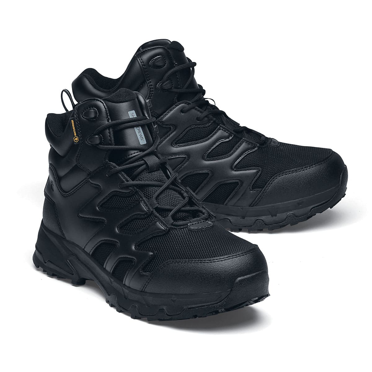 The Shoes for Crews Carrig Mid is a slip-resistant safety boot with a waterproof upper,  pair seen in the right profile with the tip of the right shoe emphasised.