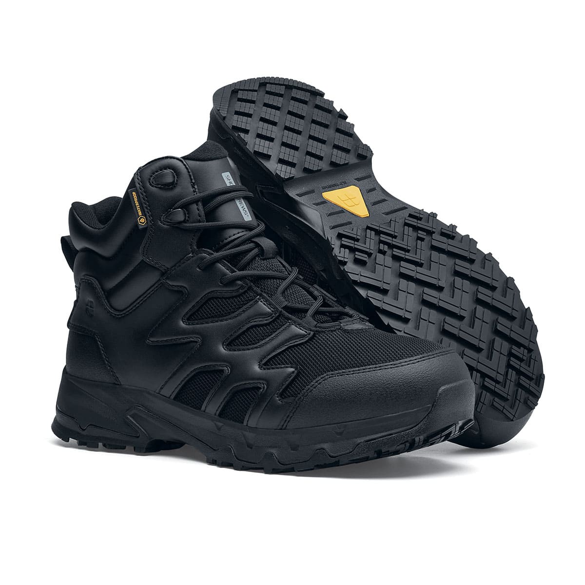 The Shoes for Crews Carrig Mid is a slip-resistant safety boot with a waterproof upper,  pair seen on the right side and on the sole.