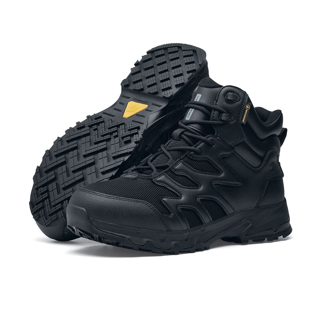 The Shoes for Crews Carrig Mid is a slip-resistant safety boot with a waterproof upper,  pair seen on the left side and on the sole.