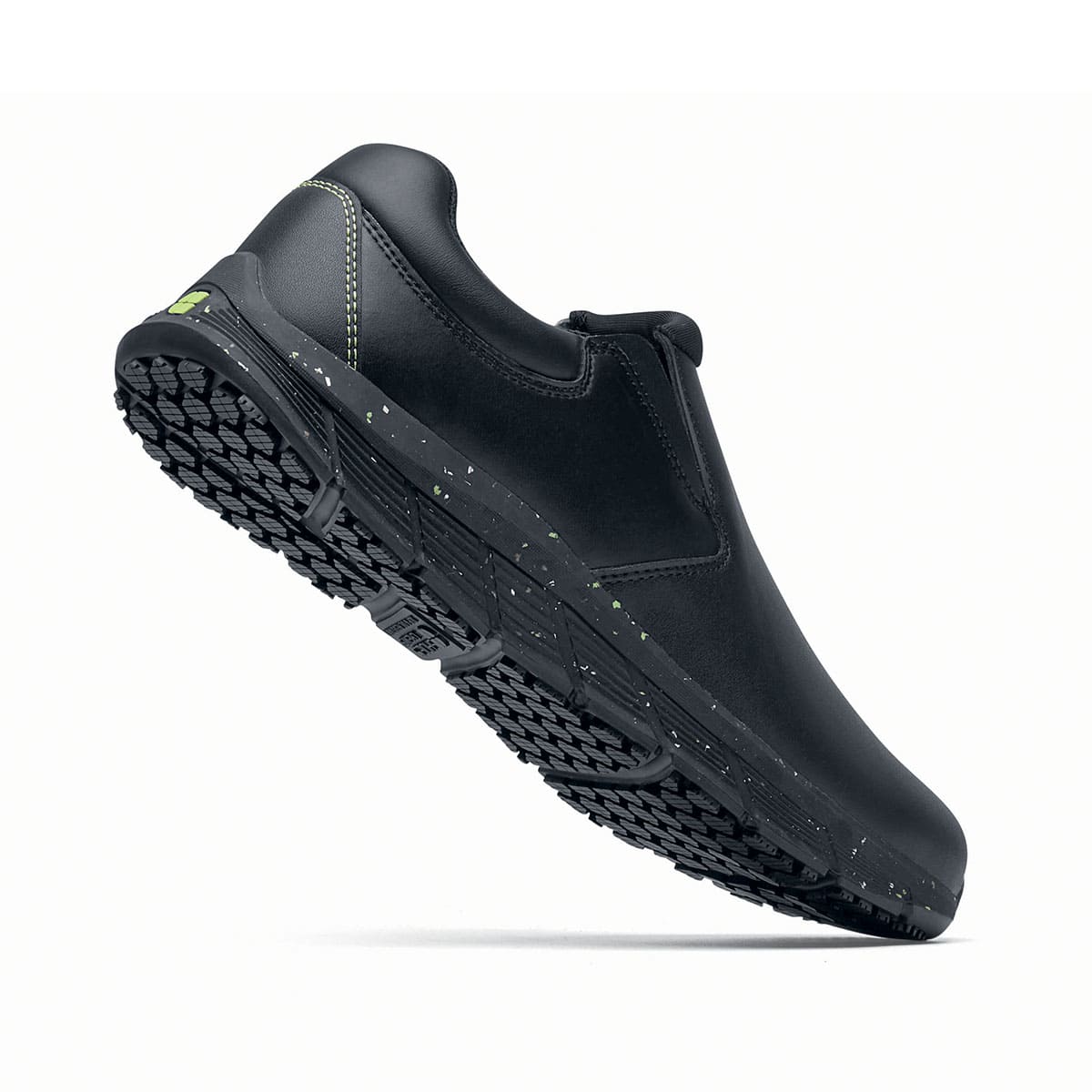 The Shoes for Crews Cater Eco Women's Black is a sustainable, slip-resistant safety shoe, seen on the right side highlighted on the heel.