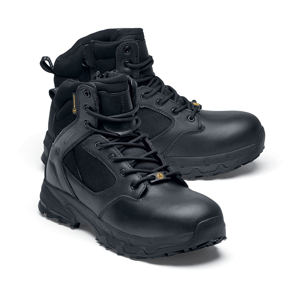 The Defence Mid from Shoes For Crews are waterproof, slip-resistant safety boots, pair seen from the right side, emphasised on the tip of the right shoe.