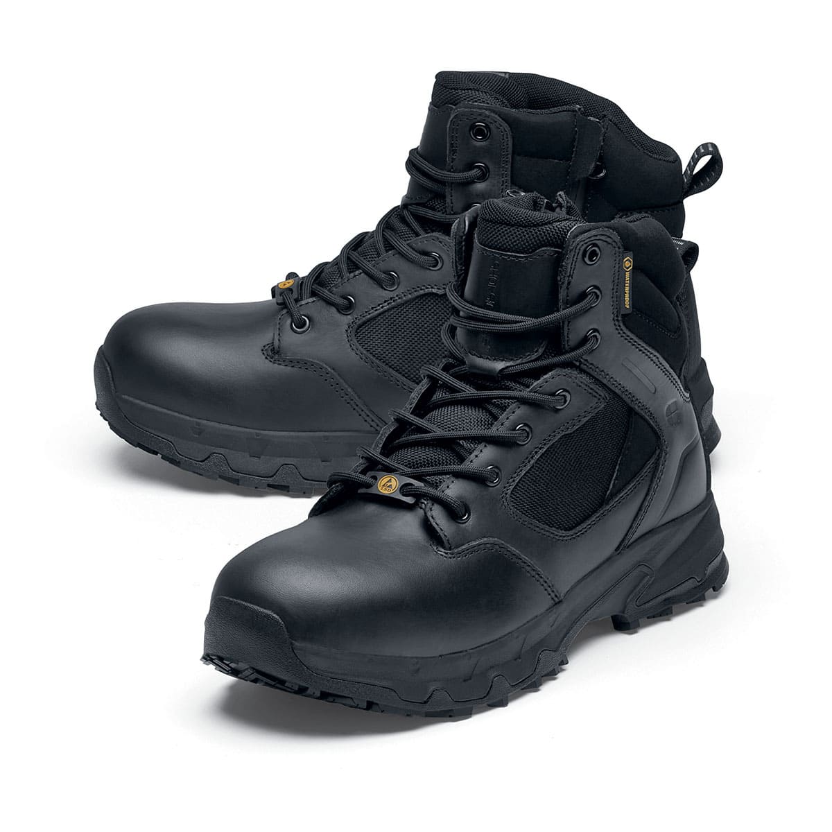 The Defence Mid from Shoes For Crews are waterproof, slip-resistant safety boots, pair seen from the left side, emphasised on the tip of the left shoe.
