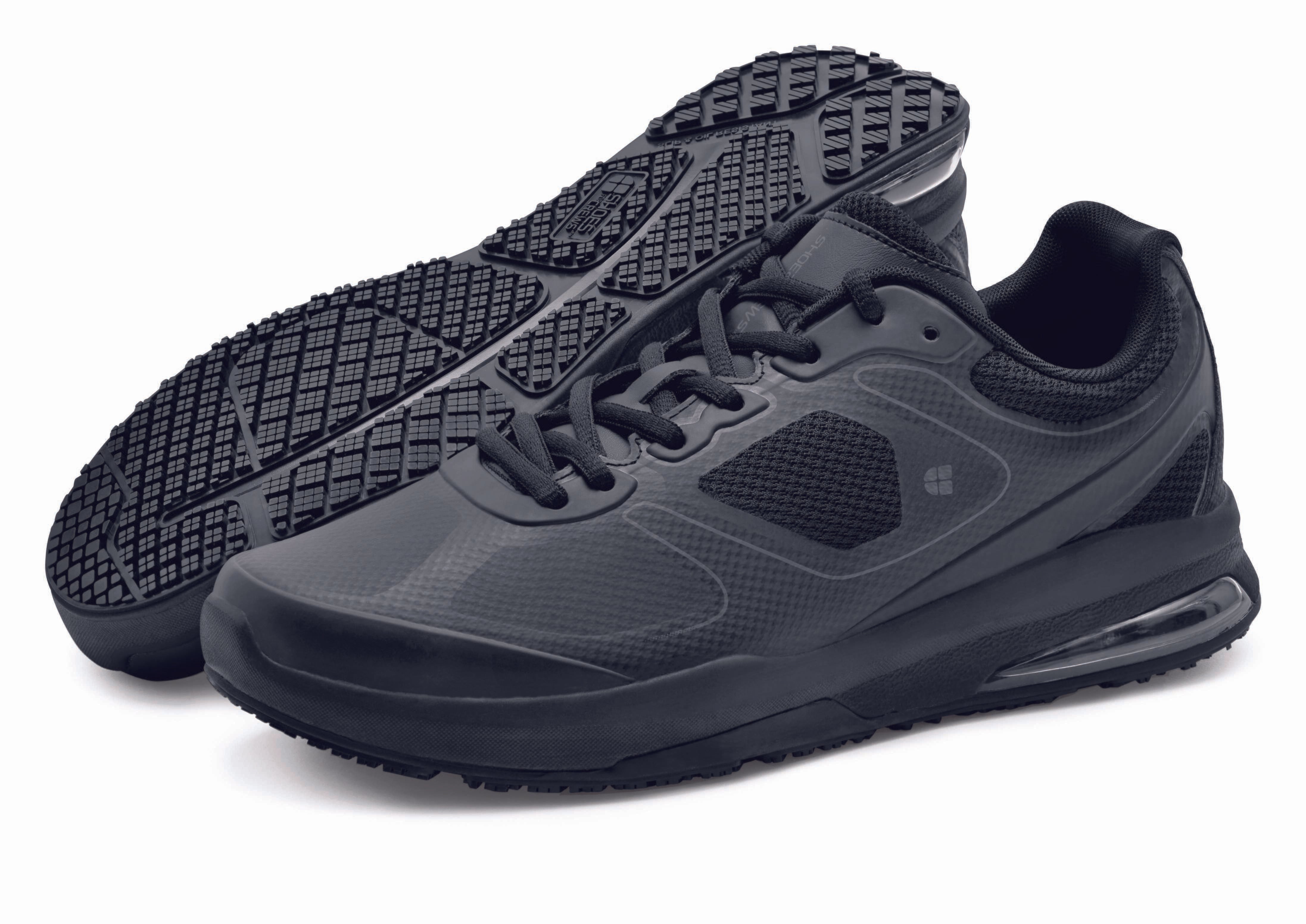 The Revolution II from Shoes For Crews are slip-resistant trainers designed to provide comfort, pair seen from the left side and the sole.