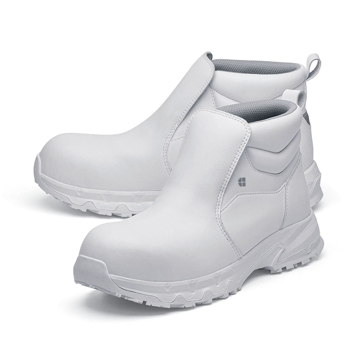 The Inny from Shoes For Crews is a safety shoe with a slip-resistant, clog-resistant upper sole and our advanced TripGuard technology, pair seen from the left side, emphasised on the tip of the left shoe.