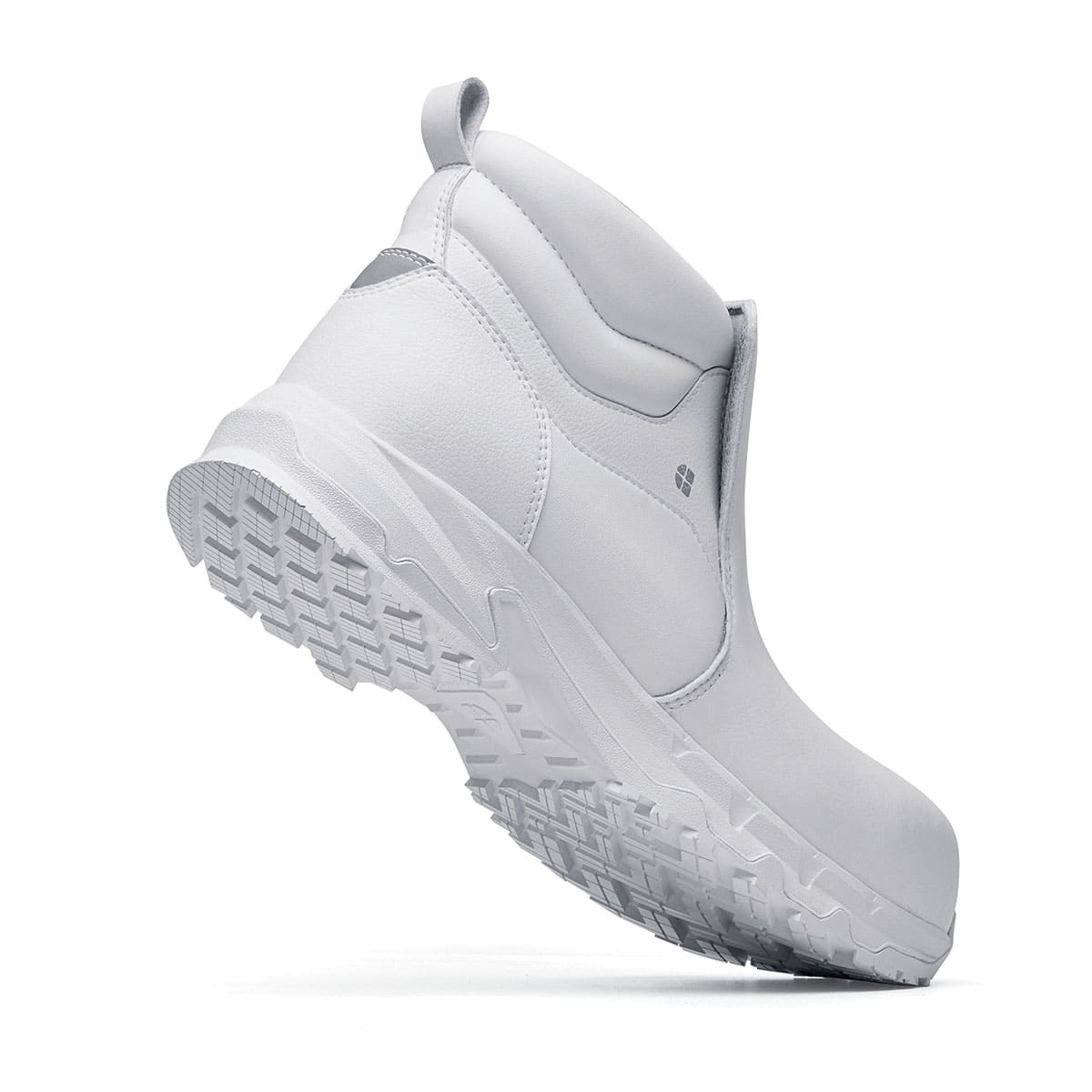 The Inny from Shoes For Crews is a safety shoe with a slip-resistant, clog-resistant upper sole and our advanced TripGuard technology,  seen from the perpendicular.