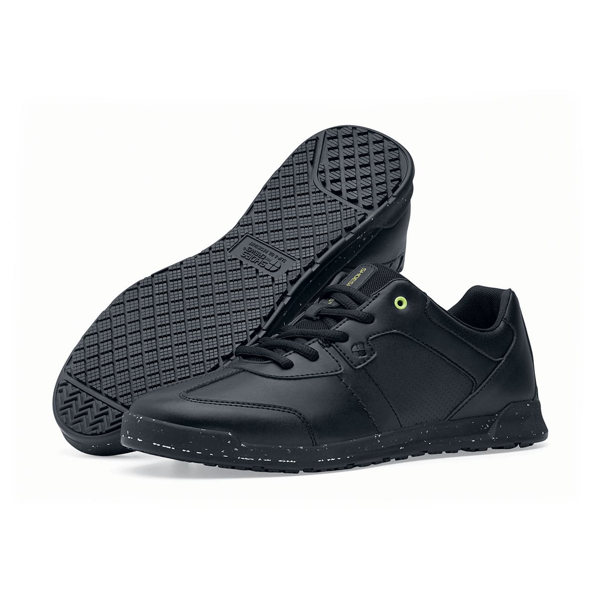 The Liberty Eco from Shoes For Crews are sustainable, slip-resistant trainers that provide comfort and safety throughout the day, pair seen from the left side and the sole.