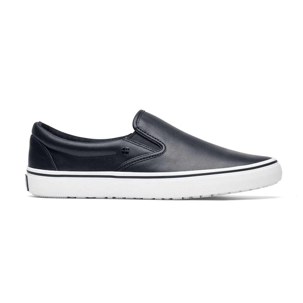 The Merlin Slip On Black and White from Shoes For Crews are slip-on trainers that are slip-resistant, lightweight, easy to clean and water-resistant, seen from the right.
