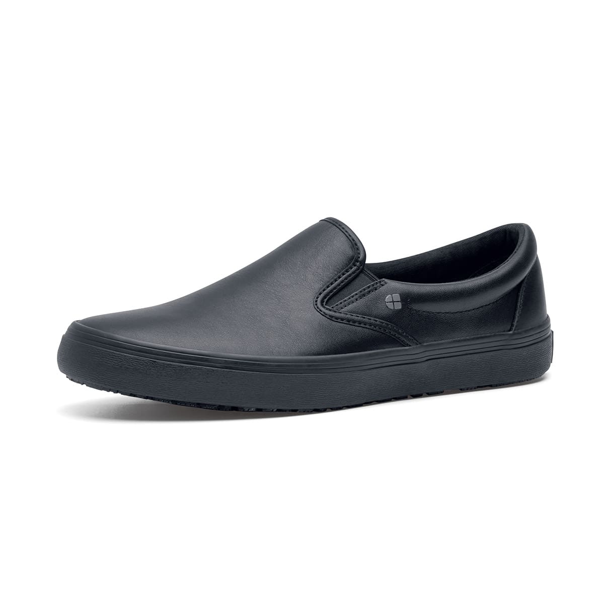 The Merlin Black from Shoes For Crews are slip-on slip resistant shoes with a lightweight design and constructed from genuine leather that has been specially treated to repel liquids from the surface, seen from the left profile.
