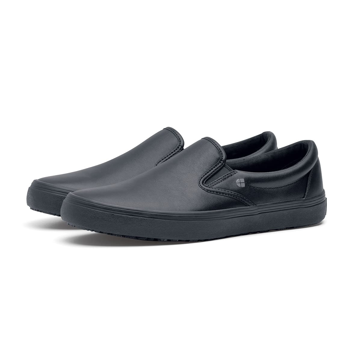 The Merlin Black from Shoes For Crews are slip-on slip resistant shoes with a lightweight design and constructed from genuine leather that has been specially treated to repel liquids from the surface, pair seen in profile on the left.