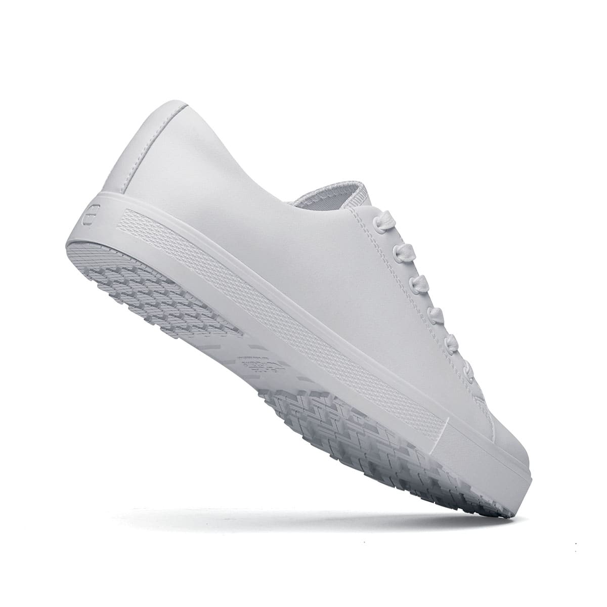 The Old School Low-Rider White from Shoes For Crews is a slip resistant lace-up designed to provide comfort throughout the day, seen from the perpendicular.