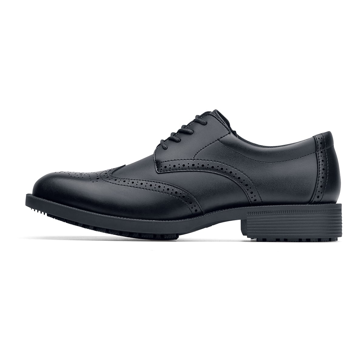 The Executive Wing Tip IV from Shoes For Crews, is an slip resistant dress shoe with a water resistant breathable leather upper to provide industry leading levels of grip and durability, seen from the left.