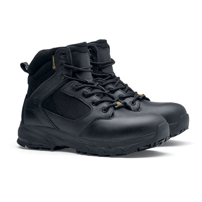The Defence Mid from Shoes For Crews are waterproof, slip-resistant safety boots, pair seen in profile on the right.
