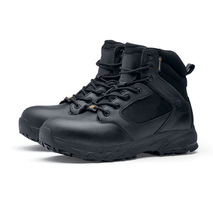 The Defence Mid from Shoes For Crews are waterproof, slip-resistant safety boots, pair seen in profile on the left.