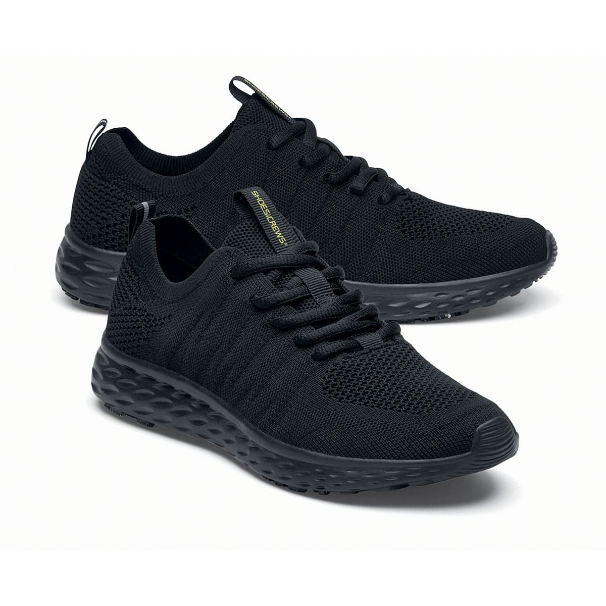 The Everlight™ Eco Men's Black from Shoes For Crews are slip-resistant trainers built with a recycled mesh upper that is water-resistant and breathable. Designed to keep your feet cool and ventilated, pair seen from the right side, emphasised on the tip of the right  shoe.