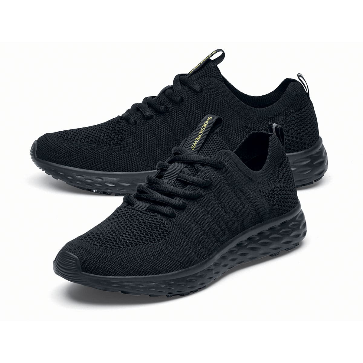 The Everlight™ Eco Men's Black from Shoes For Crews are slip-resistant trainers built with a recycled mesh upper that is water-resistant and breathable. Designed to keep your feet cool and ventilated, pair seen from the left side, emphasised on the tip of the left shoe.