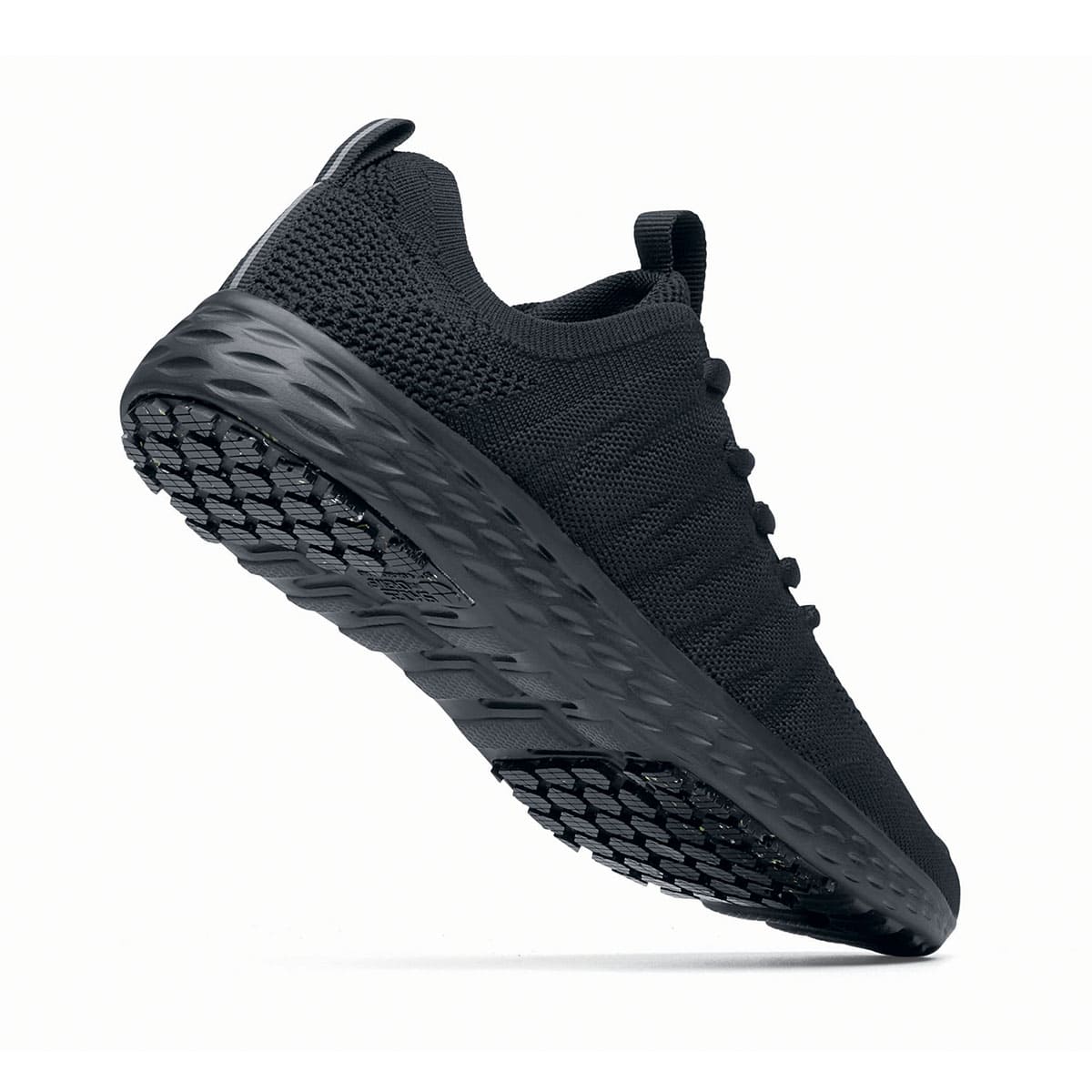 The Everlight™ Eco Men's Black from Shoes For Crews are slip-resistant trainers built with a recycled mesh upper that is water-resistant and breathable. Designed to keep your feet cool and ventilated,  seen from the perpendicular.