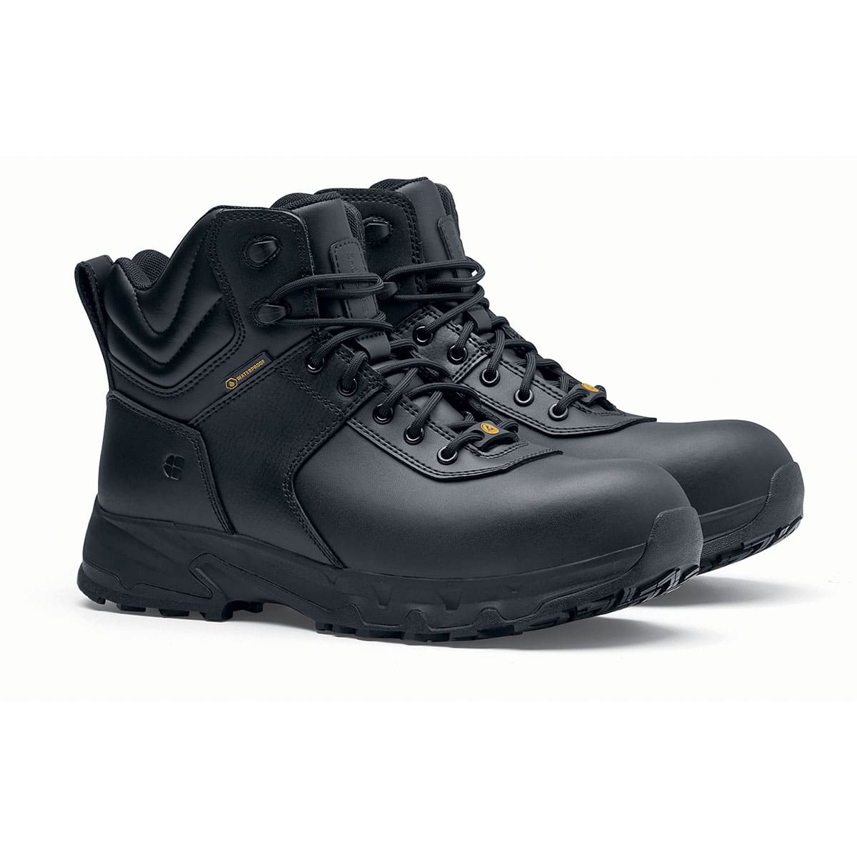 The Guard Mid from Shoes For Crews are waterproof slip-resistant safety boots with a safety toe cap, pair seen in profile on the right.