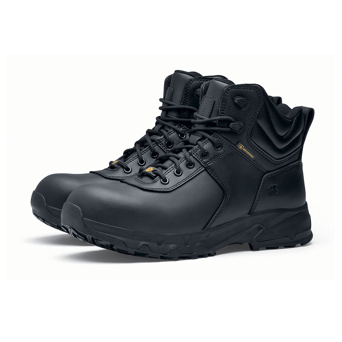 The Guard Mid from Shoes For Crews are waterproof slip-resistant safety boots with a safety toe cap, pair seen in profile on the left.