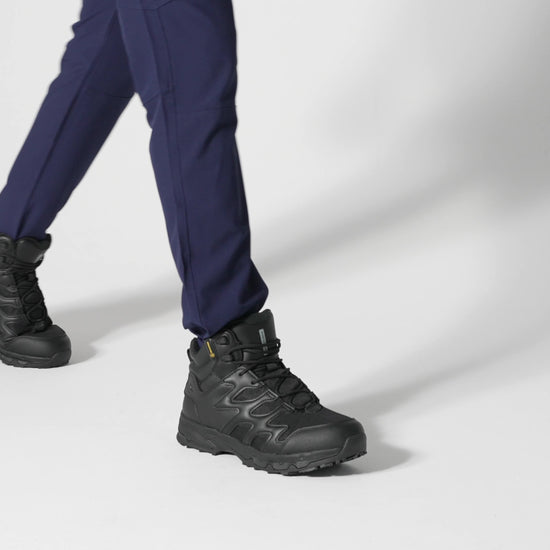 The Shoes for Crews Carrig Mid is a slip-resistant safety boot with a waterproof upper, product video.
